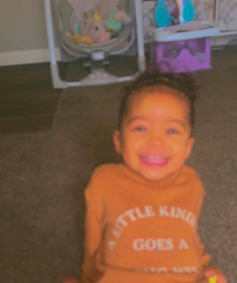 Kamilah is registered to the contest to win money with this photo: baby_toddler_clothing, cheek, chin, eye, facial_expression, floor, flooring, fun, hairstyle, happy, human_body, iris, joy, mouth, nose, person, skin, sleeve, smile, standing