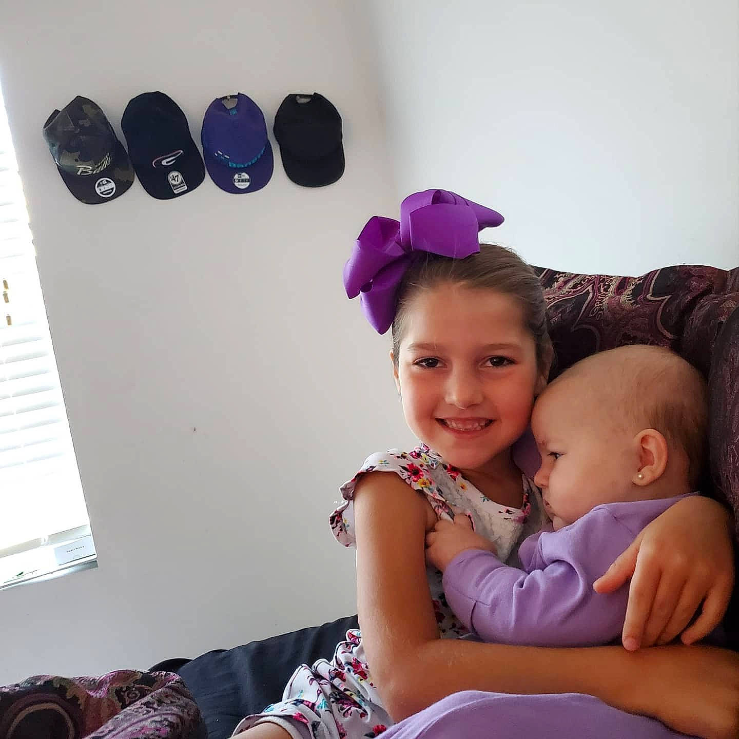 Ciara Ember is registered to the contest to win money with this photo: baby, child, ear, family, hair_accessory, happy, headband, headgear, joy, leg, people, person, pink, purple, room, sibling, sitting, skin, smile, toddler