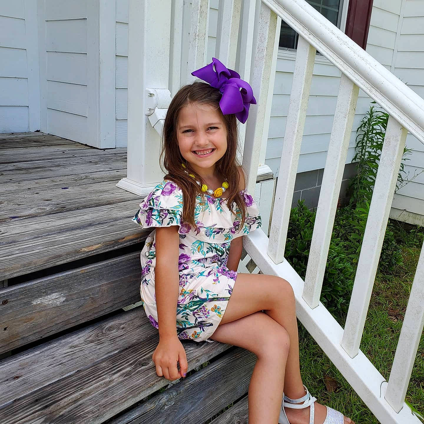 Ciara Ember is registered to the contest to win money with this photo: baby_toddler_clothing, beauty, child, child_model, clothing, dress, fashion, footwear, headgear, joy, leg, pattern, person, photography, pink, plant, purple, sitting, smile, summer