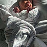 Hailey is registered to the contest to win money with this photo: newborn, baby, infant, sleeping, peaceful, smiling, face, portrait, blanket, swaddled, hospital_blanket, bed, pillow, sunlight, indoors, newborn_photography, tiny_fists, resting, cozy, family_photo