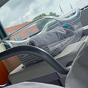 Hailey is registered to the contest to win money with this photo: baby, infant, newborn, bassinet, hospital, hospital_room, blanket, swaddled, medical_equipment, window, sky, clouds, outdoor_view, vehicle_like_bassinet, gray_blanket, clear_plastic, nursery, resting, sleeping, photograph