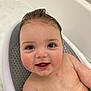 baby, child, bathtub, bath, smiling, wet_hair, teeth, skin, happy, sitting, face, child_bath, water, baby_bath_seat, closeup, cute, infant, chubby_cheeks, indoors, personal_care