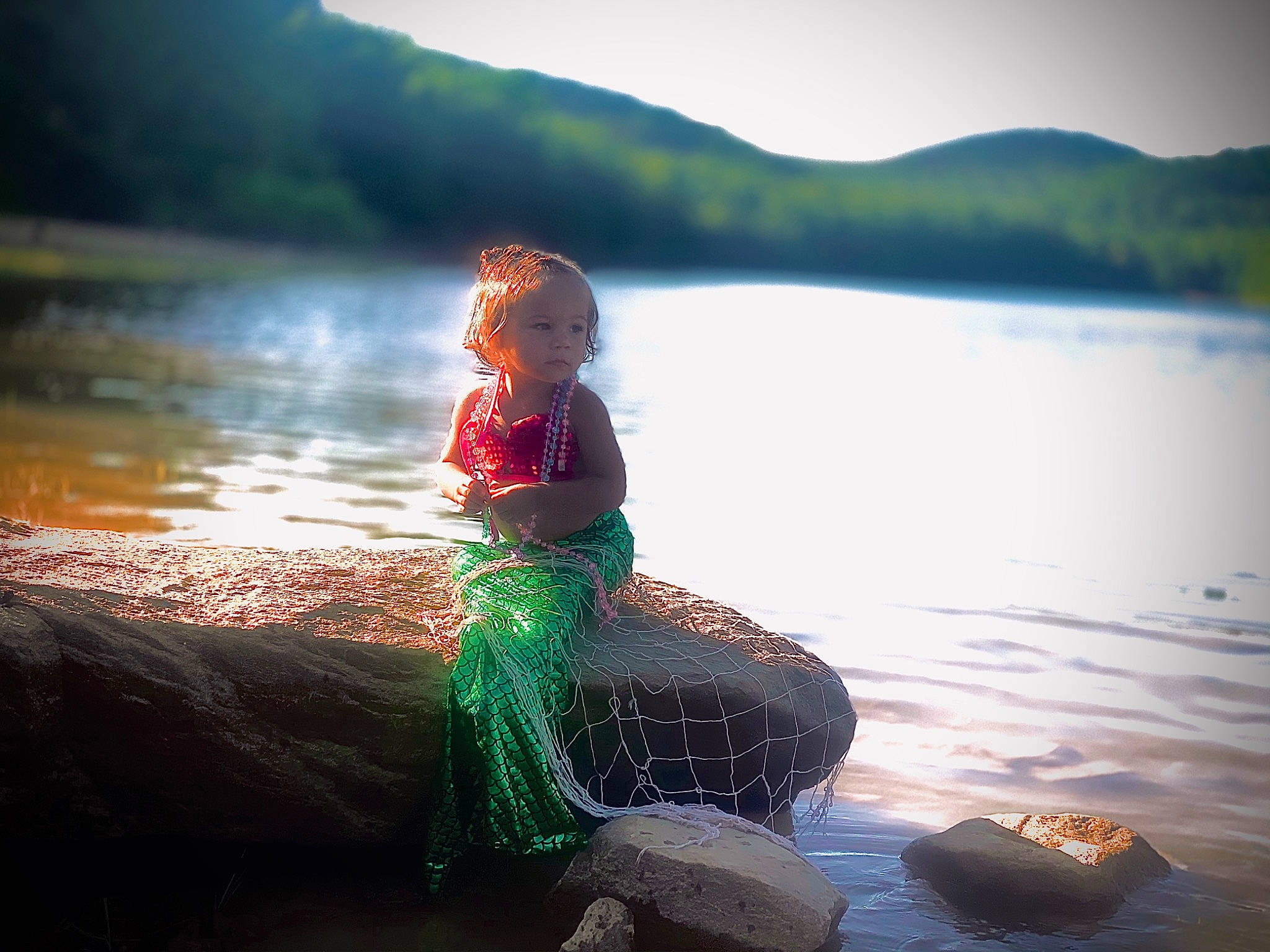 Lollah is registered to the contest to win money with this photo: beauty, cloud, dress, fictional_character, green, lake, morning, nature, people_in_nature, person, photography, reflection, rock, sea, sitting, sky, summer, sunlight, tree, vacation