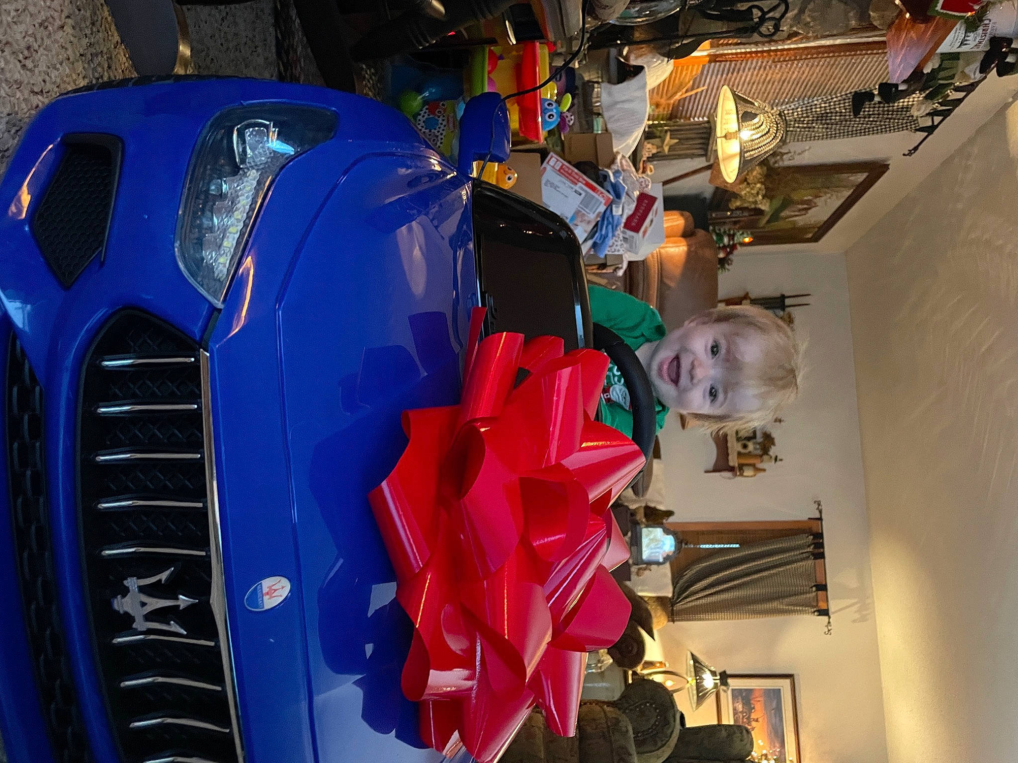 Bennett is registered to the contest to win money with this photo: automotive_design, automotive_exterior, automotive_lighting, bumper, car, carmine, classic, classic_car, electric_blue, event, fun, grille, headlamp, hood, joy, machine, motor_vehicle, person, personal_protective_equipment, suit