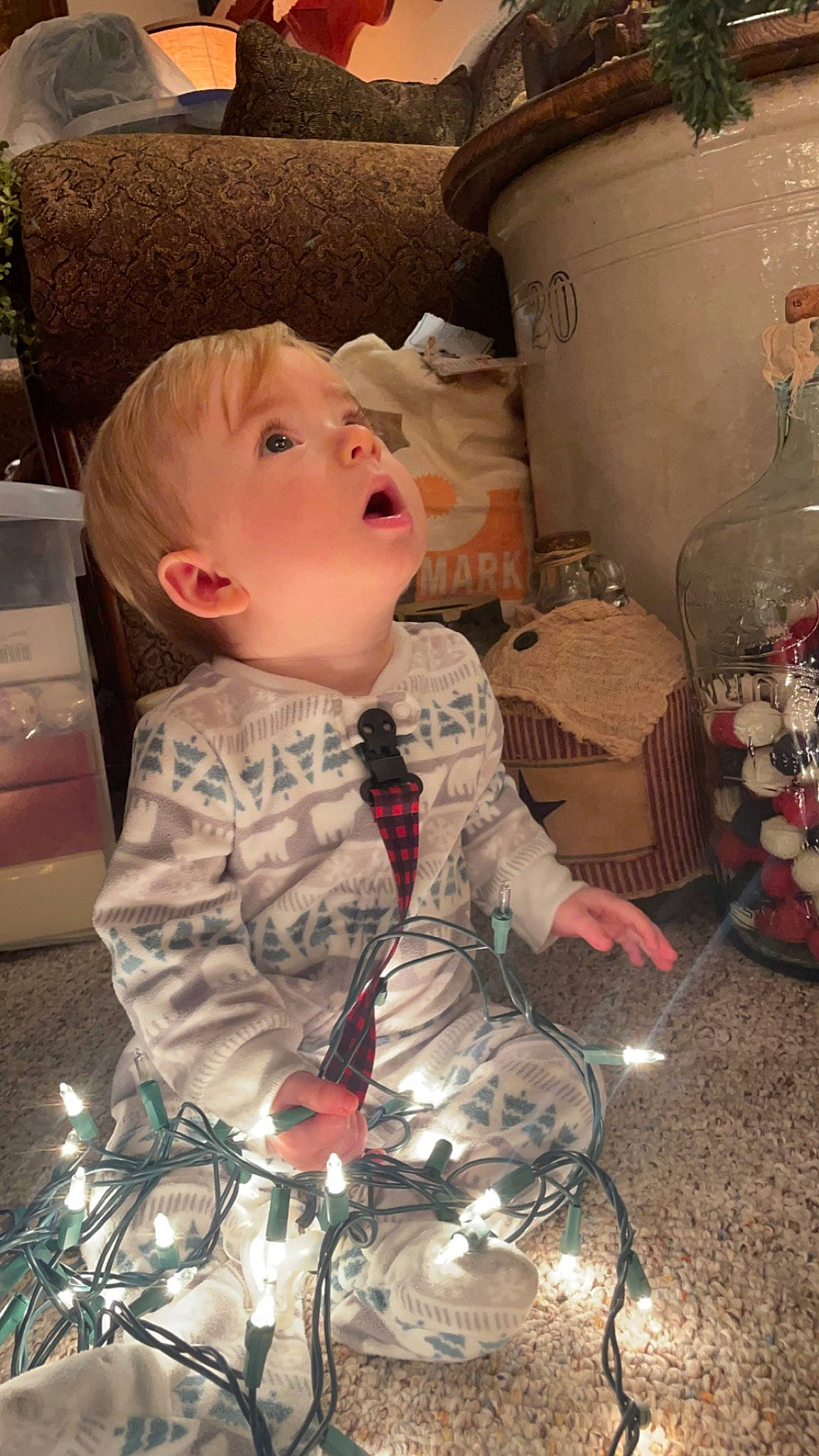 Bennett is registered to the contest to win money with this photo: baby, cheek, child, doll, event, pattern, person, pink, room, sitting, surprise, textile, toddler, toy