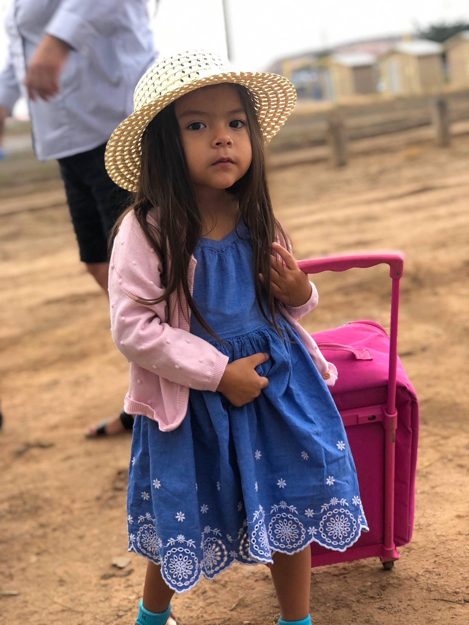 Tobie is registered to the contest to win money with this photo: blue, cap, child, clothing, electric_blue, fashion_design, happy, hat, headwear, leisure, neck, people, person, photograph, purple, shoe, shoulder, sleeve, sun_hat, travel