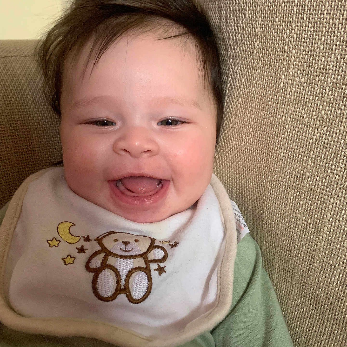 Kimarna is registered to the contest to win money with this photo: accessories, baby, babylaughing, bib, couch, cushion, face, furniture, happy, head, homedecor, jewelry, laughing, necklace, newborn, person, photography, portrait, smile