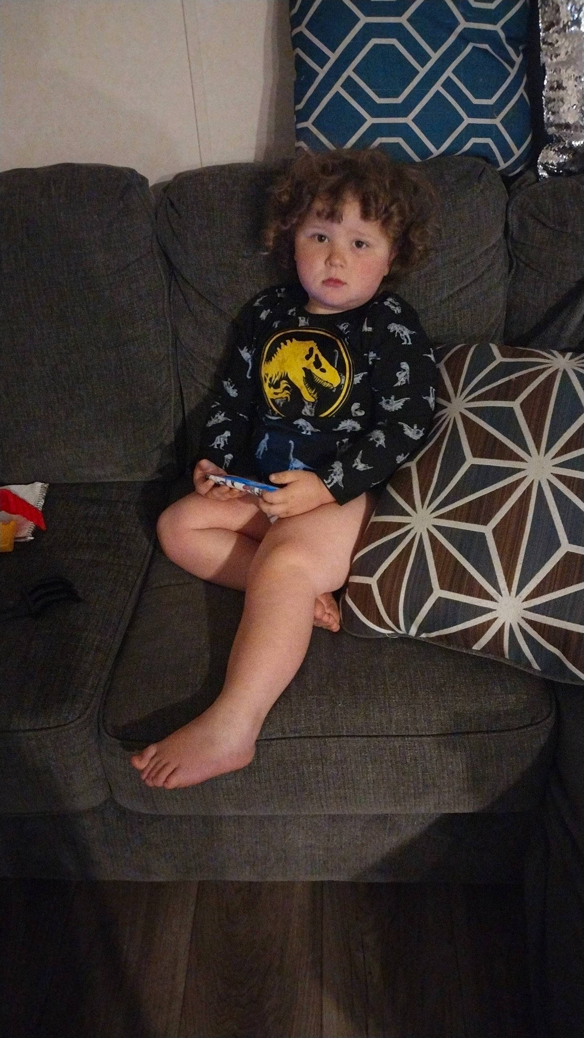 Caleb Charles joined the competition — help win amazing prizes! baby_toddler_clothing, barefoot, comfort, couch, floor, flooring, foot, human_leg, knee, lap, living_room, pattern, person, pillow, sitting, sleeve, sock, sofa_bed, thigh, toddler