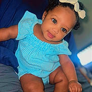 Mi'Aila joined the competition — help win amazing prizes! baby, child, infant, smiling, blue_outfit, bow, headband, sitting, bed, comfort, cute, skin, face, eyes, hand, foot, indoors, portrait, happy, young