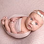 baby, infant, newborn, wrapped, pink, headband, flower, soft_texture, lace, curious, face, skin, hands, feet, portrait, closeup, cute, lying_down, child, indoors