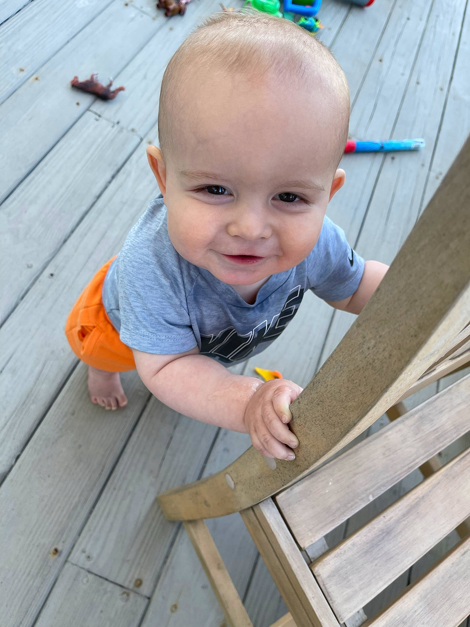 Beckett joined the competition — help win amazing prizes! baby, baby_toddler_clothing, blue, cheek, child, flooring, fun, grass, green, happy, hardwood, leisure, person, plank, sitting, skin, smile, thumb, toddler, wood