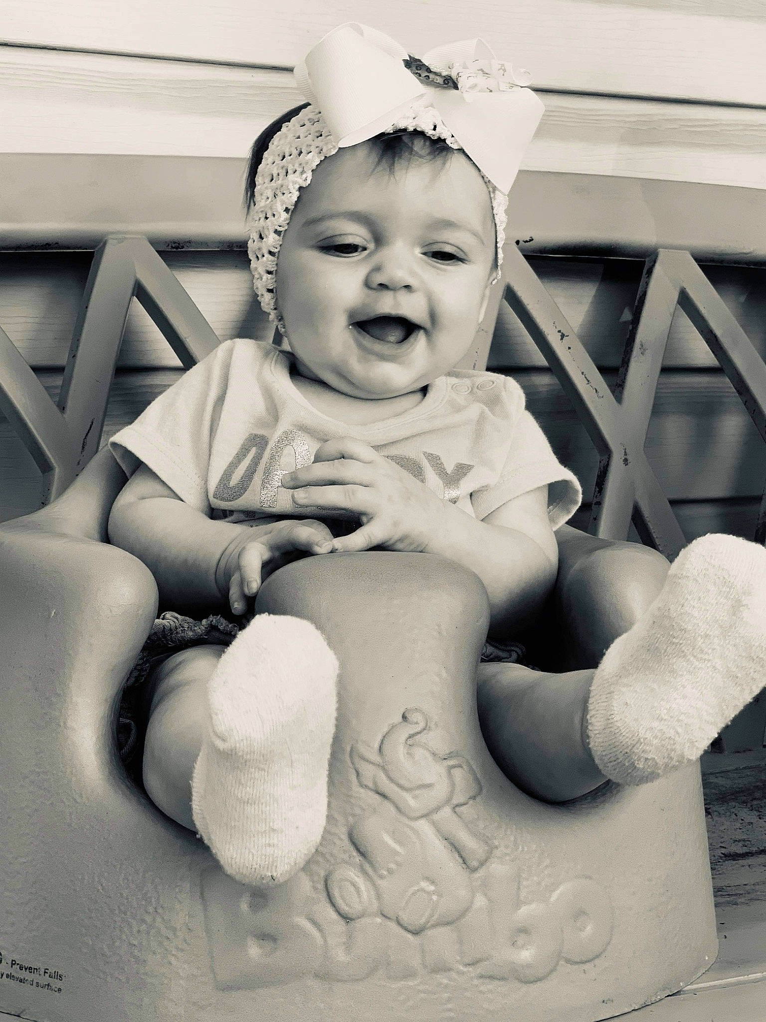 Kassidy is registered to the contest to win money with this photo: art, baby, black_and_white, child, ear, headgear, person, photograph, photography, sitting, smile, stock_photography, style, toddler, white