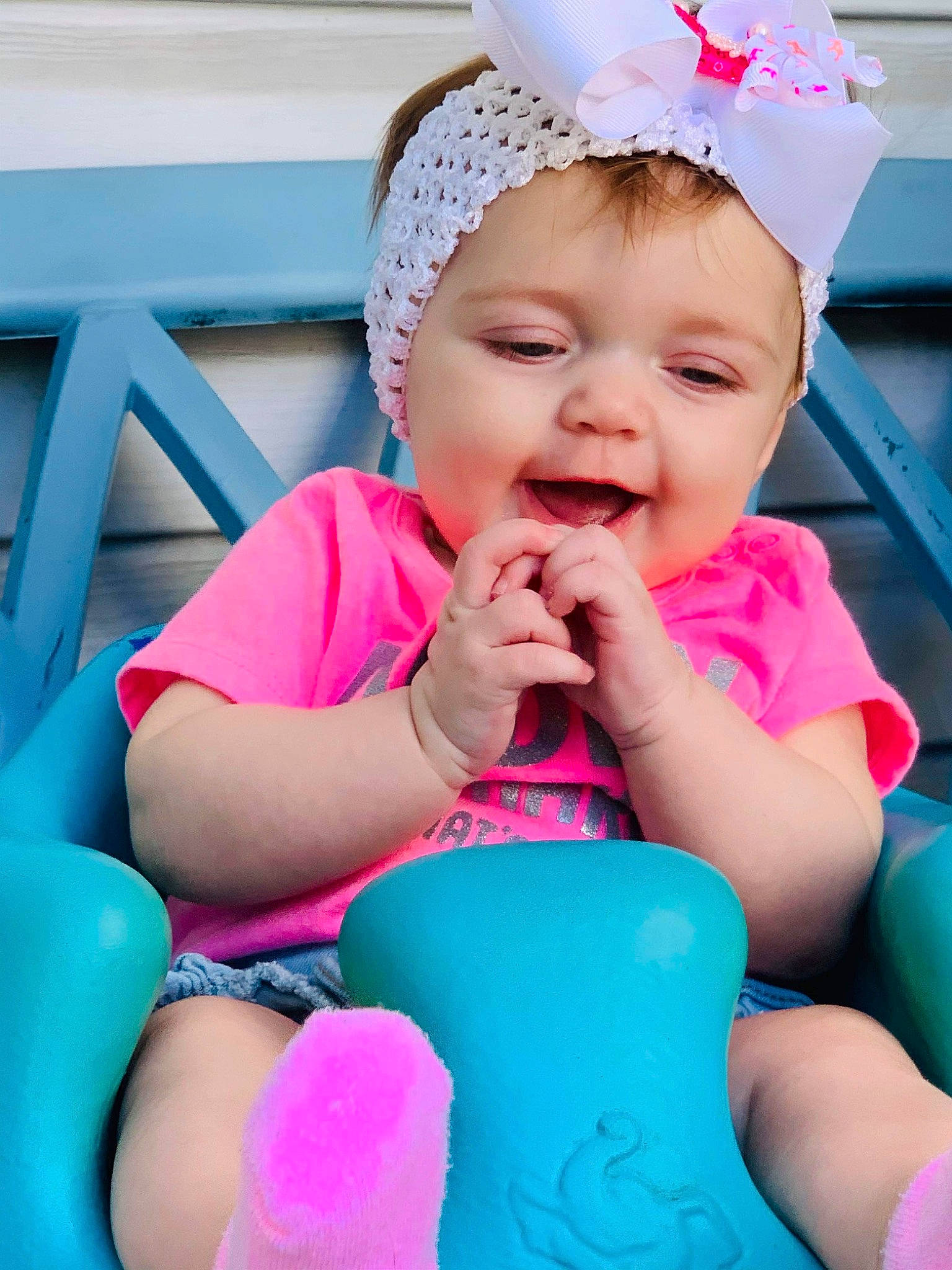 Kassidy joined the competition — help win amazing prizes! baby, blue, cap, child, fashion_accessory, fun, headgear, headwear, leisure, party_supply, person, pink, play, sitting, skin, smile, summer, sun_hat, toddler, turquoise