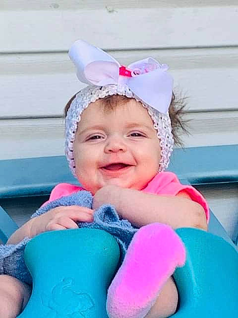 Kassidy is registered to the contest to win money with this photo: baby, blue, child, ear, facial_expression, fashion_accessory, fun, hair_accessory, happy, headgear, headwear, joy, laugh, neck, person, photography, pink, play, product, skin