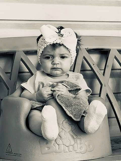 Kassidy is registered to the contest to win money with this photo: baby, black_and_white, child, child_model, fashion_accessory, hair_accessory, headgear, headpiece, headwear, person, photograph, photography, sitting, snapshot, stock_photography, toddler