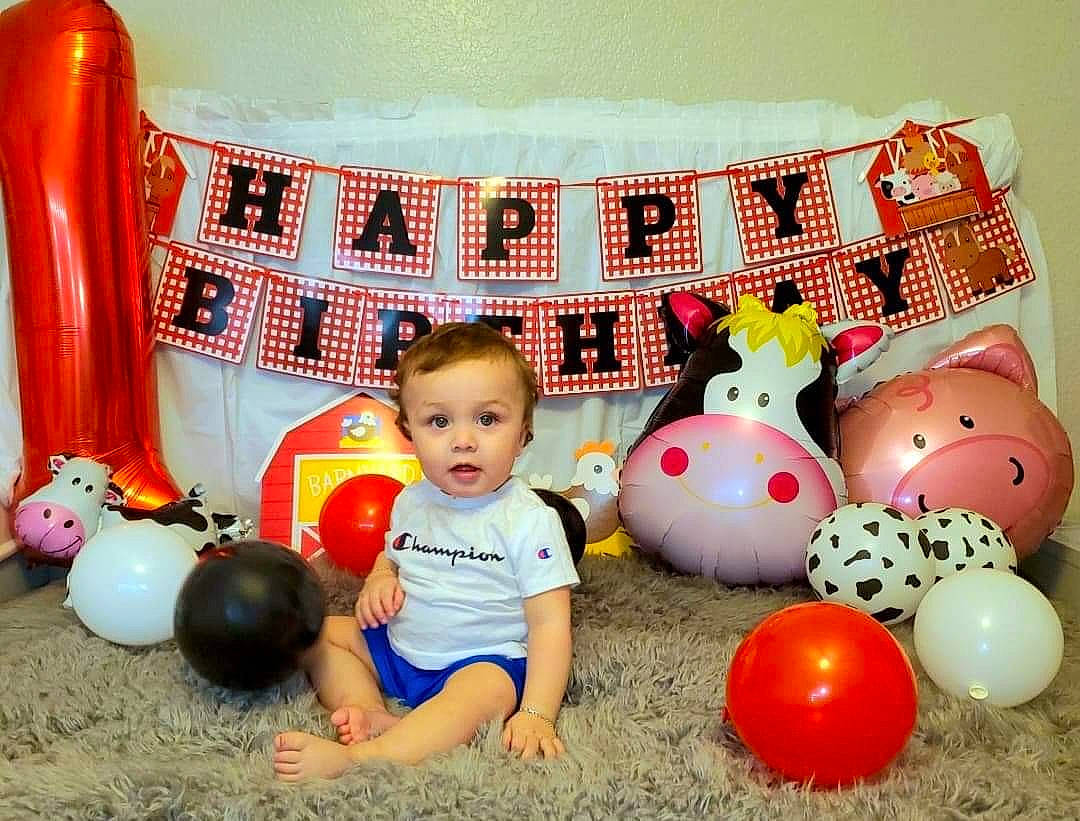 Aziel is registered to the contest to win money with this photo: baby_playing_with_toys, balloon, beauty, chair, child, comfort, couch, flooring, fun, happy, leg, leisure, orange, party_supply, person, pillow, product, table, toddler, toy