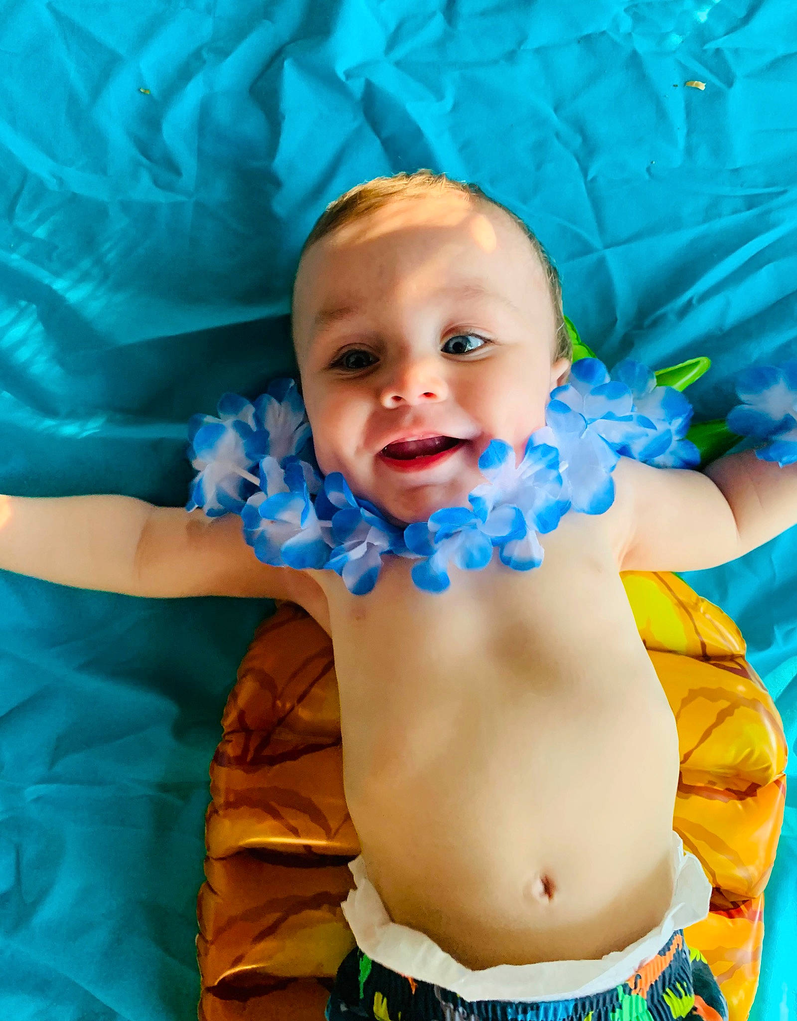 Aziel is registered to the contest to win money with this photo: abdomen, aqua, azure, baby, baby_toddler_clothing, blue, cheek, chest, eye, finger, happy, head, iris, mouth, person, photograph, skin, textile, toddler, trunk