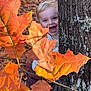 Kays a rejoint le concours — aidez-le/la à gagner de superbes lots ! child, toddler, tree, autumn_leaves, forest, nature, outdoor, playful, smiling, happy, blond_hair, fall, bark, foliage, seasonal, person, cute, young, joyful, exploration