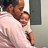 Eziah joined the competition — help win amazing prizes! man, baby, smile, hug, love, indoor, portrait, clothing, facial_hair, earring, dreadlocks, casual, skin, expression, joy, parent, child, affection, holding, sitting