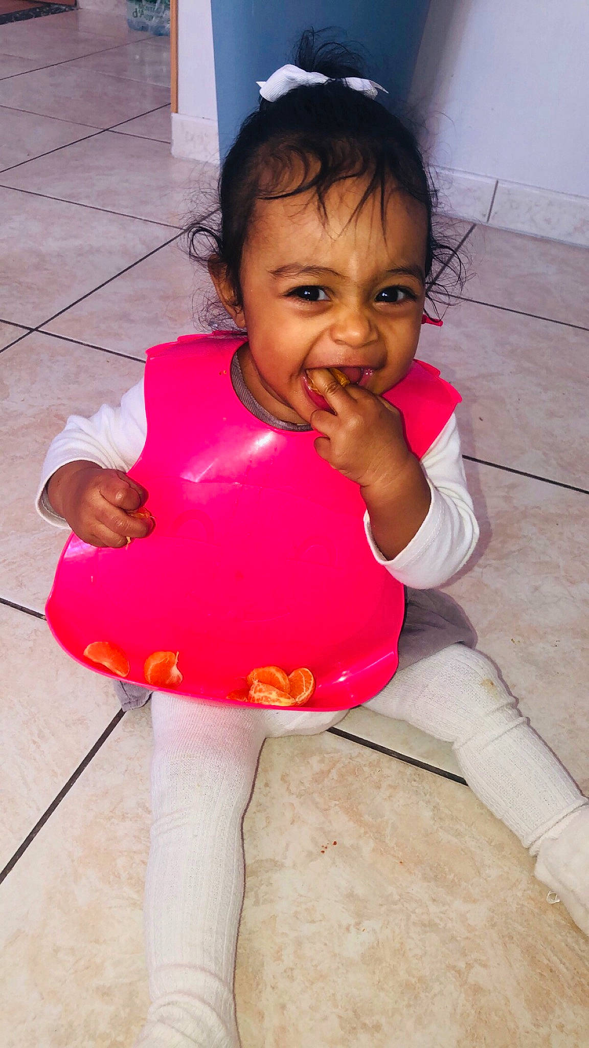 Inaya participe au concours pour gagner de l'argent avec cette photo : baby_toddler_clothing, cheek, dress, eye, face, finger, fun, gesture, hair, happy, head, joint, lip, magenta, nose, person, pink, skin, sleeve, smile