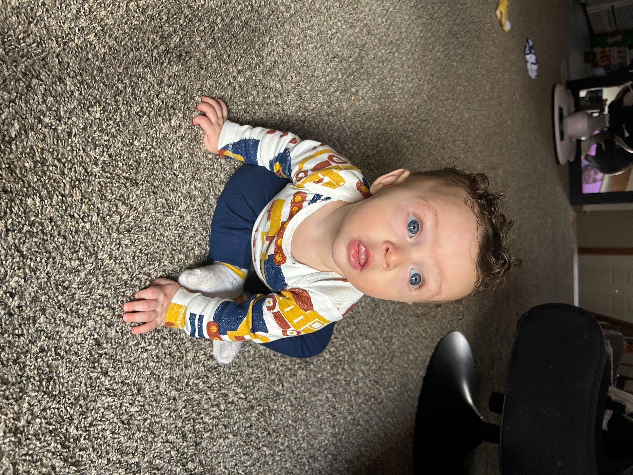 Legacy is registered to the contest to win money with this photo: asphalt, baby, baby_toddler_clothing, chair, child, comfort, floor, flooring, fun, person, shelf, sitting, sleeve, surprise, toddler, wood