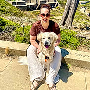 Maximus joined the competition — help win amazing prizes! bridge, concrete, dog, footwear, golden_retriever, grass, hill, landscape, leash, nature, outdoor, pet, smile, sunglasses, sunny, tattoo, tourist, tree, water, woman