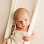 Livio participe au concours pour gagner de l'argent avec cette photo : baby, baby_fashion, child, closeup, cream_color, curious_expression, cute, gentle_lighting, hammock, indoors, infant, knitted_outfit, neutral_background, newborn, portrait, skin, sleepy_eyes, small_hands, soft_texture, young_baby