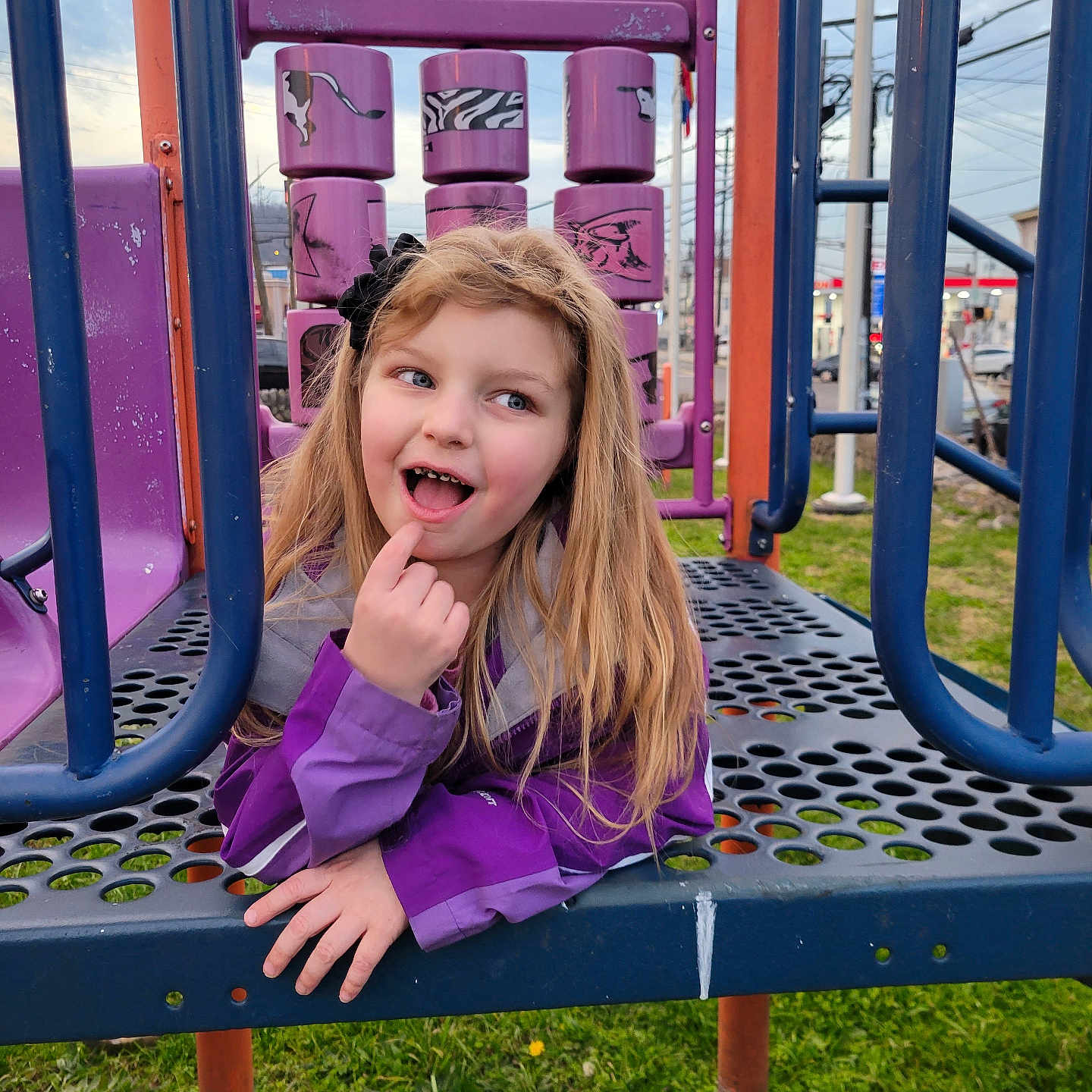 Peyton Lillian is registered to the contest to win money with this photo: car, child, face, female, girl, grass, head, nature, outdoorplayarea, outdoors, park, person, photography, plant, playarea, portrait, slide, toy, transportation, vehicle
