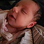 infant, newborn, baby, sleeping, close_up, cheek, ear, hair, blanket, swaddle, soft_texture, portrait, indoors, cozy, peaceful, mouth, nose, eyelashes, skin, face