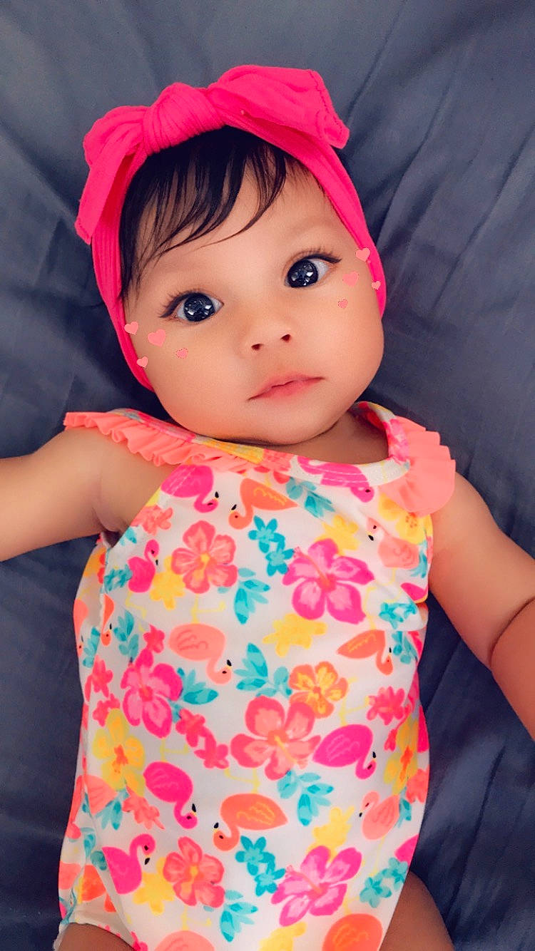 Maleni is registered to the contest to win money with this photo: baby, baby_products, baby_toddler_clothing, cheek, child, clothing, hair_accessory, headgear, headwear, lip, nap_mat, peach, person, pink, product, skin, toddler