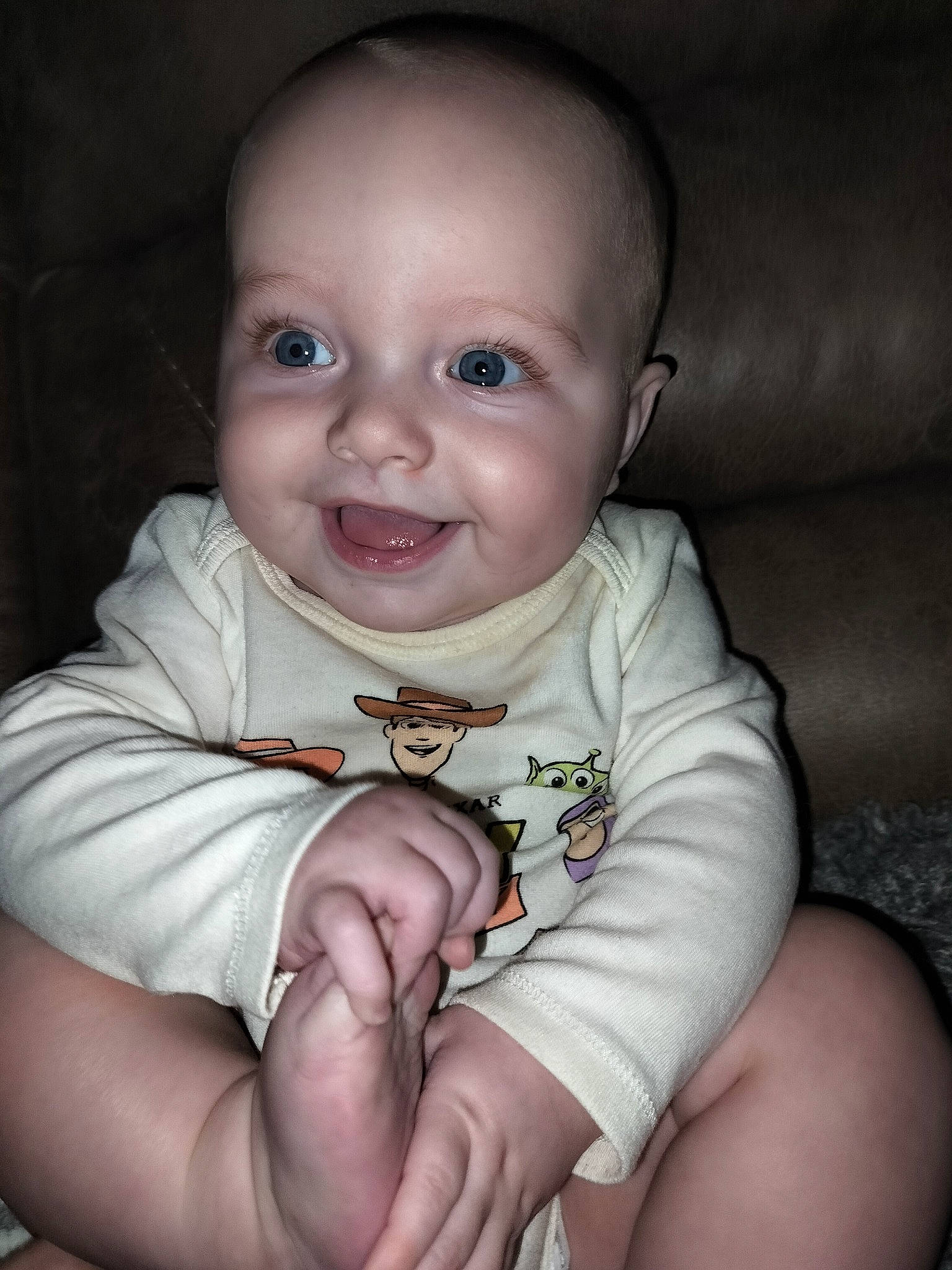 Cassius is registered to the contest to win money with this photo: arm, baby, baby_toddler_clothing, cheek, comfort, eye, eyebrow, face, finger, flash_photography, gesture, hand, happy, iris, joy, lip, mouth, nose, person, skin