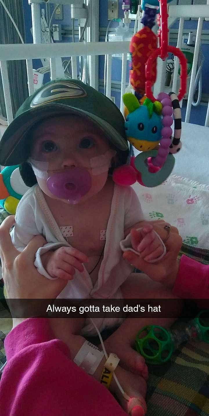 Teagan is registered to the contest to win money with this photo: cap, child, event, font, fun, green, happy, headwear, magenta, party_supply, person, petal, pink, purple, rose, rose_order, smile, stuffed_toy, sweetness, toddler