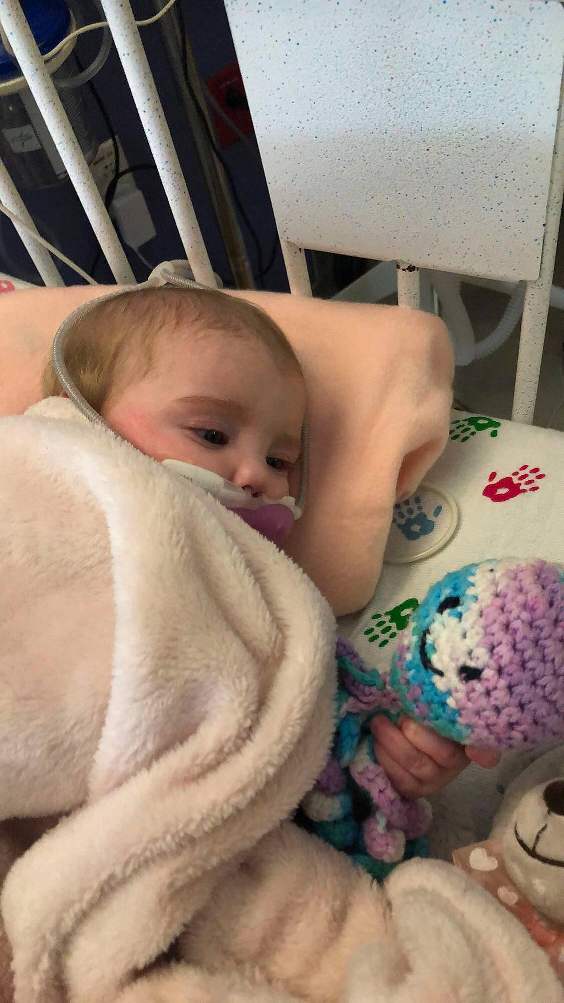 Teagan joined the competition — help win amazing prizes! baby, baby_products, baby_safety, baby_sleeping, bed_sheet, bedding, car_seat, child, comfort, eye, fur, linens, mammal, nose, pattern, person, room, sitting, skin, textile