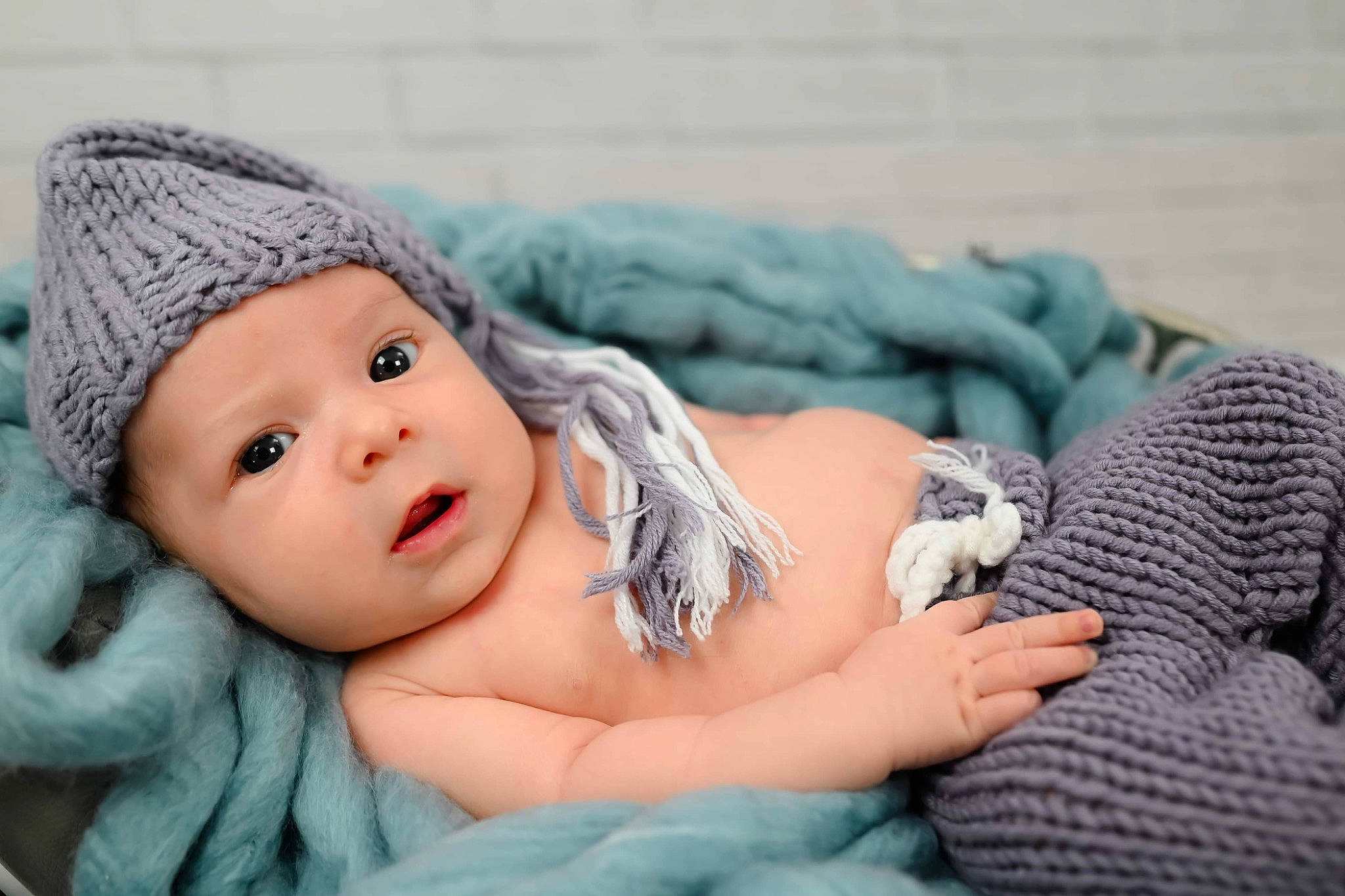 Ethan is registered to the contest to win money with this photo: baby, baby_sleeping, beanie, cap, child, comfort, fashion_accessory, fur, grass, happy, headgear, headpiece, headwear, knit_cap, linens, lip, person, portrait_photography, sitting, skin