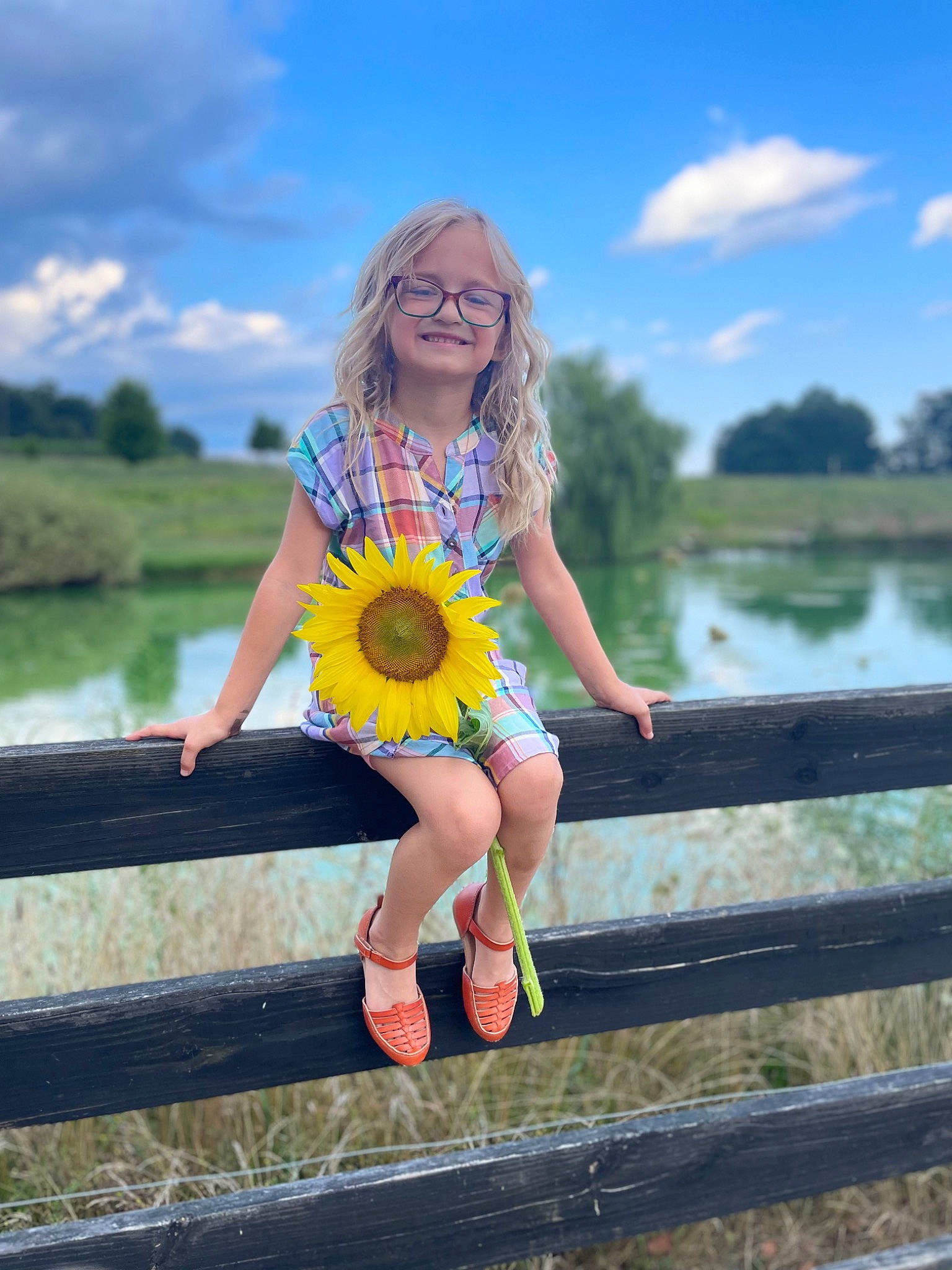 Aubreigh joined the competition — help win amazing prizes! body_of_water, cloud, dress, flash_photography, flower, glasses, grass, hairstyle, happy, joy, lake, leisure, people_in_nature, person, plant, shoulder, sky, street_fashion, sunlight, tree
