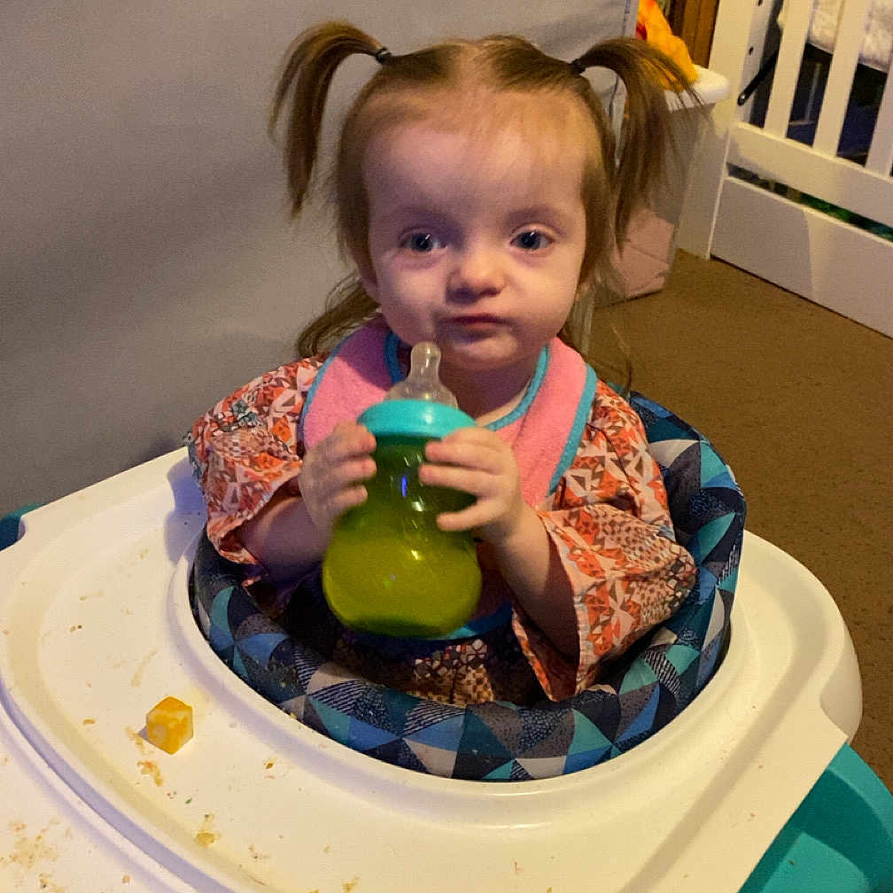 Macy Mae is registered to the contest to win money with this photo: baby, beverage, cutlery, diningtable, dish, face, food, furniture, head, indoors, jar, juice, meal, person, photography, portrait, pottery, spoon, table, vase