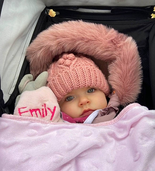 Emily joined the competition — help win amazing prizes! baby, baby_sleeping, baby_toddler_clothing, cap, cheek, comfort, eye, face, hand, headwear, knit_cap, linens, lip, nose, person, pink, product, skin, sleeve, textile