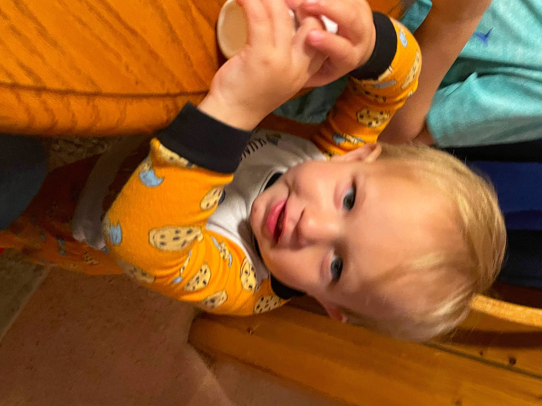 Houston is registered to the contest to win money with this photo: baby, baby_products, cheek, child, comfort, flooring, fun, happy, hardwood, leisure, mouth, nose, orange, person, play, sitting, skin, thumb, toddler, varnish