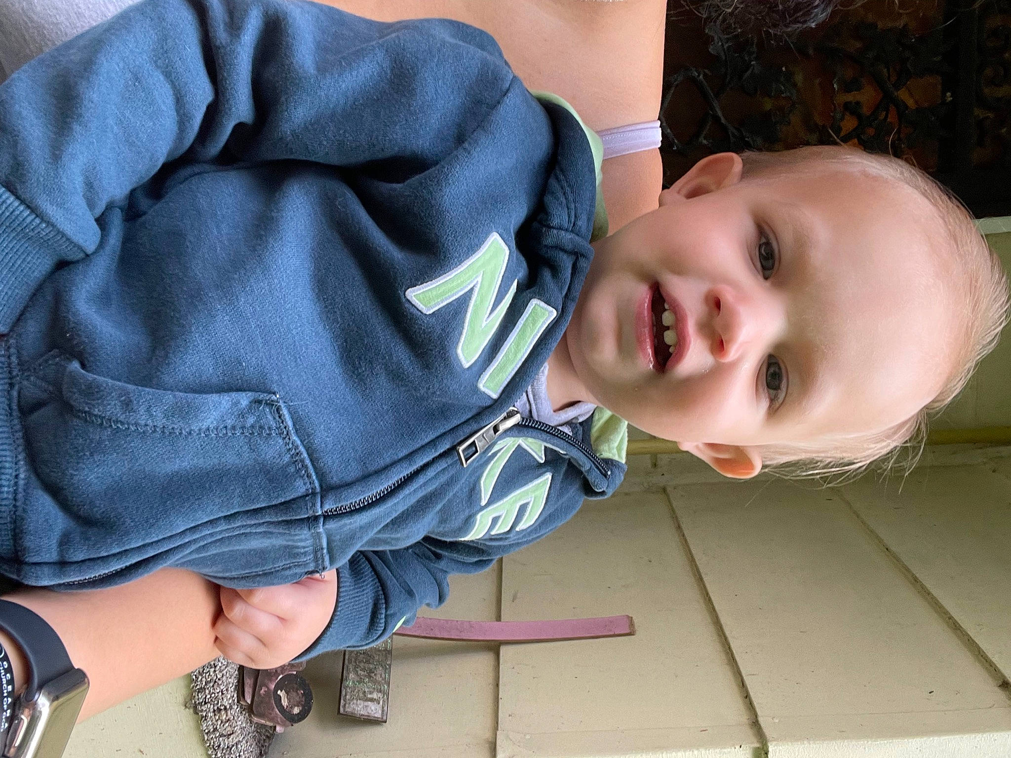 Houston is registered to the contest to win money with this photo: baby, baby_toddler_clothing, cheek, comfort, eye, face, finger, flooring, grass, hand, happy, head, leg, nose, person, skin, sleeve, smile, toddler, tree