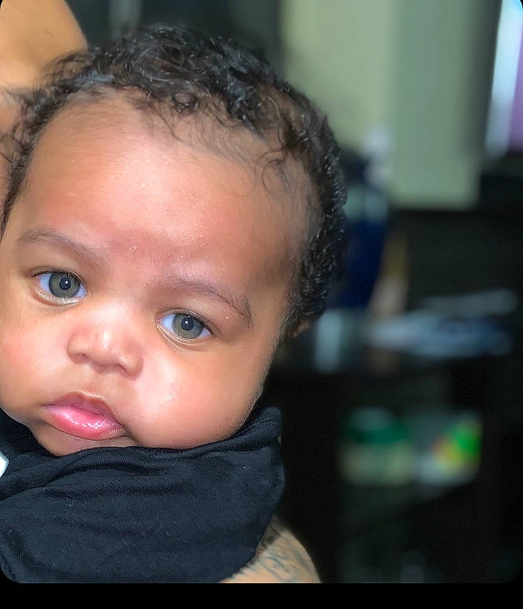 Amari is registered to the contest to win money with this photo: baby, baby_toddler_clothing, black_hair, cheek, child, ear, eyelash, flash_photography, forehead, fun, happy, iris, jaw, lip, no_expression, nose, person, portrait_photography, sitting, sleeve