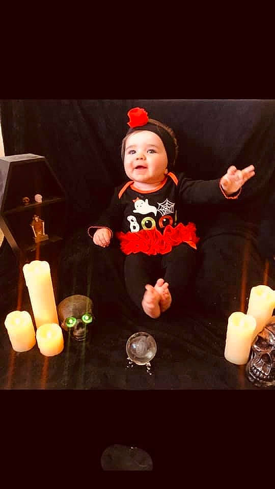 Ember is registered to the contest to win money with this photo: candle, child, headwear, lighting, night, party_supply, person, play, toddler