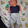Montie joined the competition — help win amazing prizes! baby, newborn, infant, blanket, clothing, onesie, pants, socks, lying_down, cartoon, pattern, colorful, cute, small, portrait, baby_boy, indoors, soft, peaceful, resting
