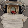 Mason joined the competition — help win amazing prizes! newborn, baby, car_seat, blanket, hat, infant, sleeping, cozy, wrapped, child, person, floor, indoor, cute, soft, warm, bundle, tiny, headwear, transport