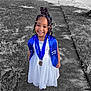 blue_stole, braided_hair, celebration, child, color_pop, cute, festive, girl, graduation, grass, happy, medal, outdoor, person, portrait, sidewalk, smiling, sunlight, white_dress, young