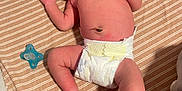 Jesrah is registered to the contest to win money with this photo: baby, blanket, child, cozy, cute, diaper, human, indoors, infant, lying_down, newborn, pacifier, peaceful, resting, skin, sleeping, small, soft, striped_blanket, toddler