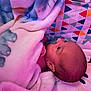 Jesrah joined the competition — help win amazing prizes! baby, blanket, pacifier, infant, playmat, colorful, geometric_pattern, cartoon_character, head, face, sleepwear, soft_texture, indoor, cute, newborn, child, comfort, lying_down, pink_lighting, resting