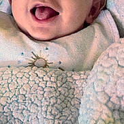 Kayden Knight joined the competition — help win amazing prizes! baby, smiling, tongue_out, blanket, cozy, infant, face, cute, happy, child, soft_texture, warm, indoors, closeup, portrait, clothing, head, person, newborn, resting