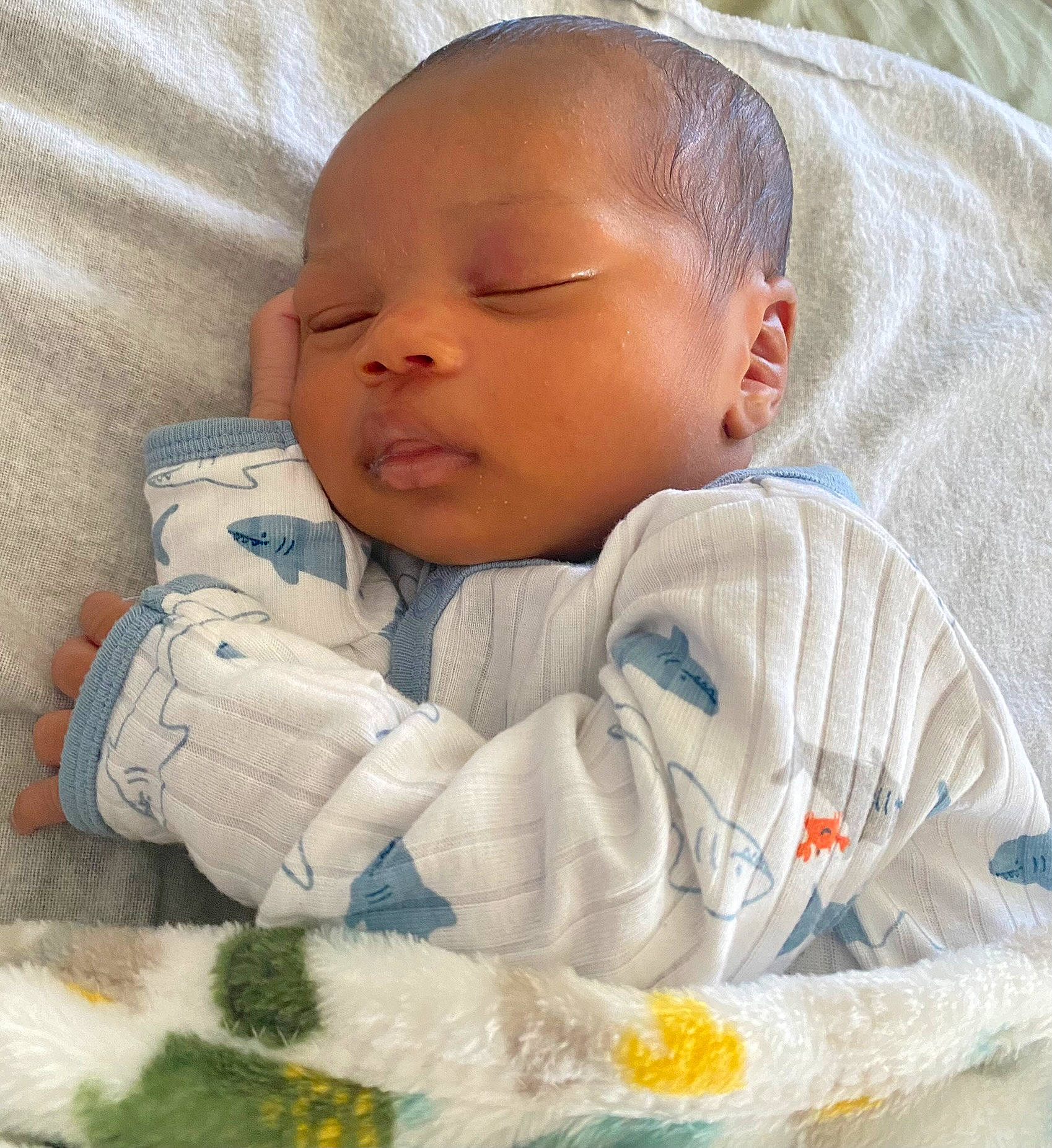 Amir joined the competition — help win amazing prizes! baby, baby_products, baby_sleeping, baby_toddler_clothing, bedding, bedtime, cheek, child, comfort, eye, head, human_body, iris, linens, nose, pattern, person, sitting, skin, sleeve