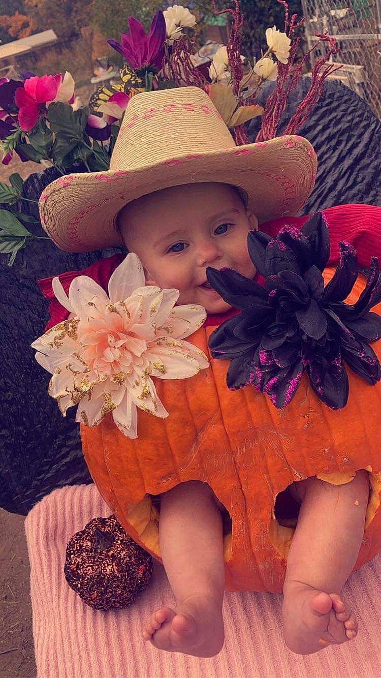 Aspen joined the competition — help win amazing prizes! baby_toddler_clothing, costume_hat, dress, eye, fedora, finger, flower, happy, hat, head, headgear, headpiece, headwear, leaf, light, person, petal, photograph, pink, plant