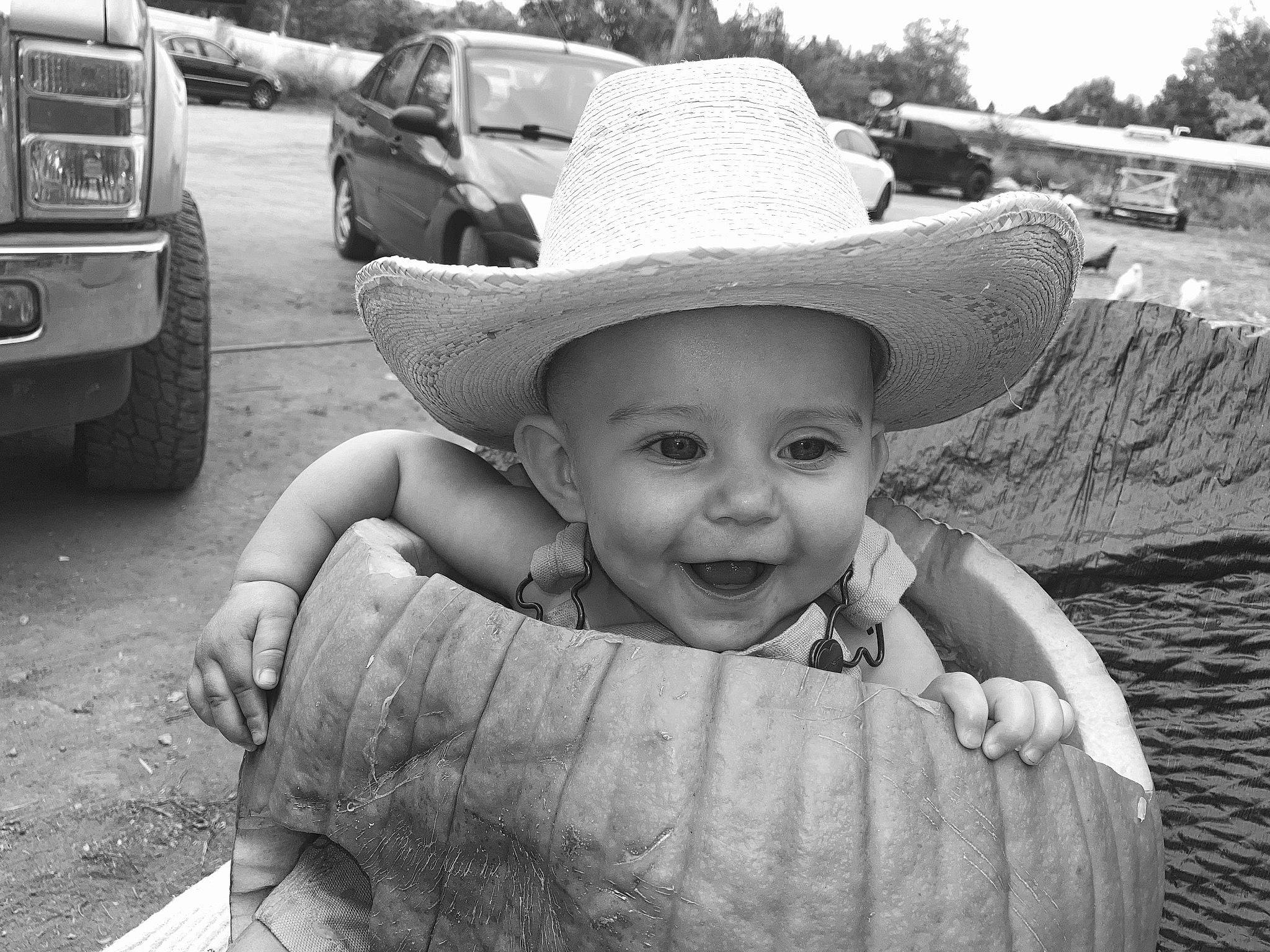 Aspen joined the competition — help win amazing prizes! automotive_exterior, automotive_tire, black, black_and_white, fender, grass, happy, hat, headgear, headwear, human, joy, monochrome, person, photograph, rural_area, smile, style, sun_hat, tire